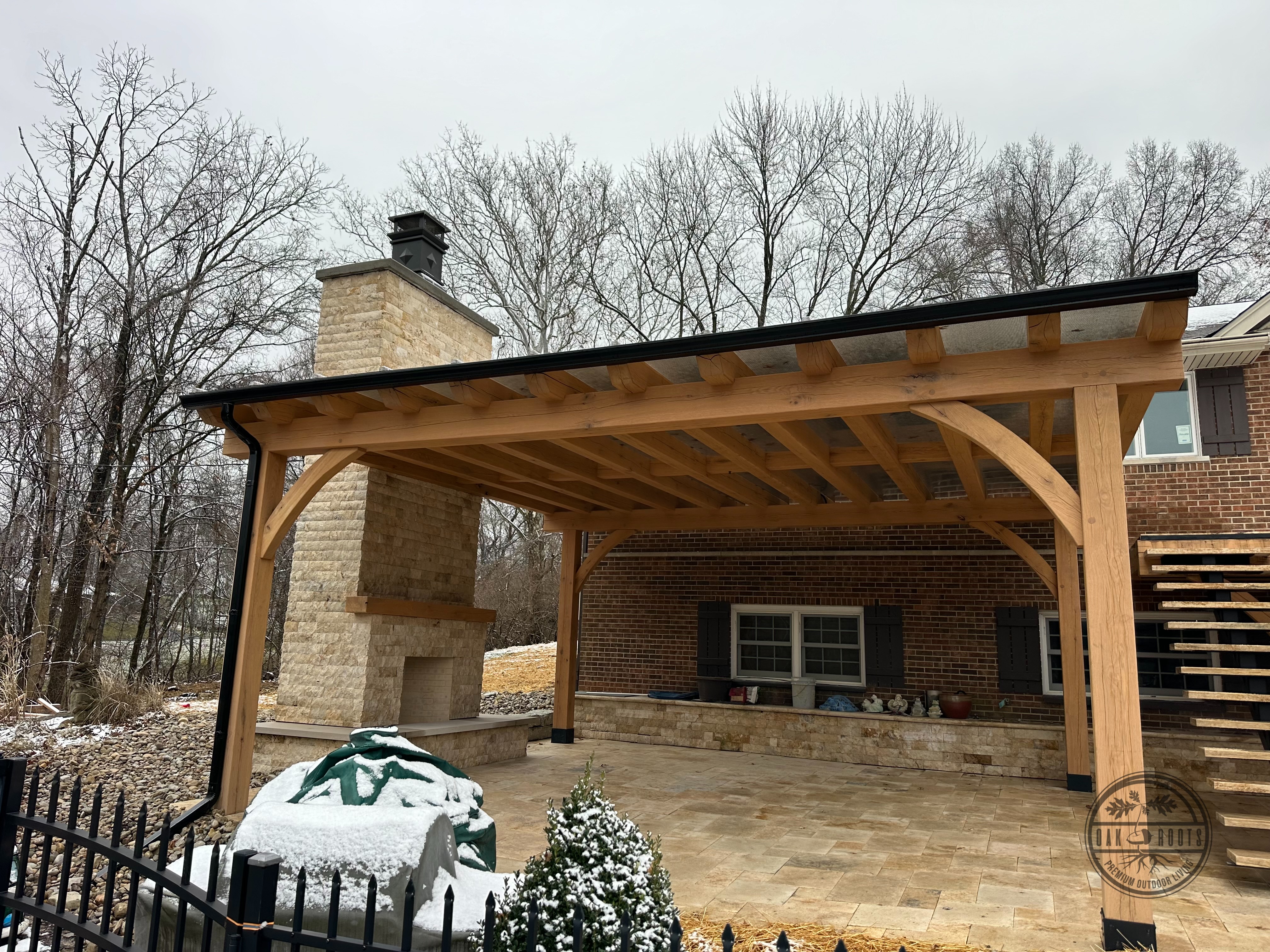 Douglas fir pergola over outdoor living space by Oak Roots LLC Milan Indiana